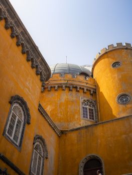Detailed view of the colorful turrets and architecture of Pena Palace in Lisbon, Portugal.