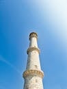 Historic Marble Tower Against Clear Blue Sky