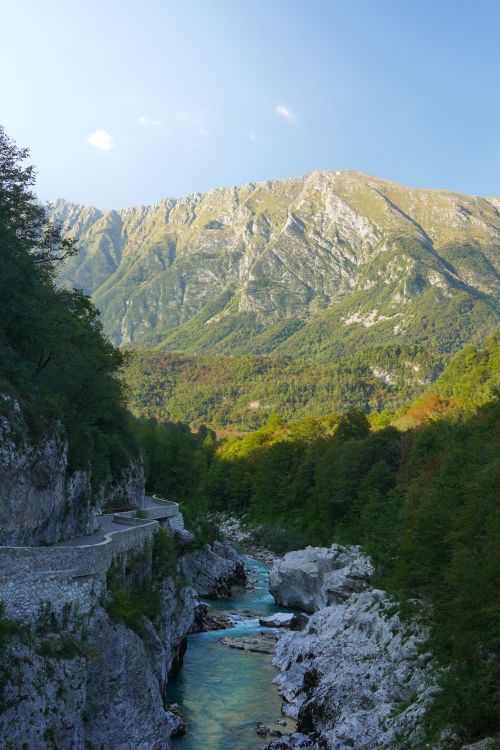 Free Breathtaking view of the Soča River surrounded by mountains in Kobarid, Slovenia. Stock Photo