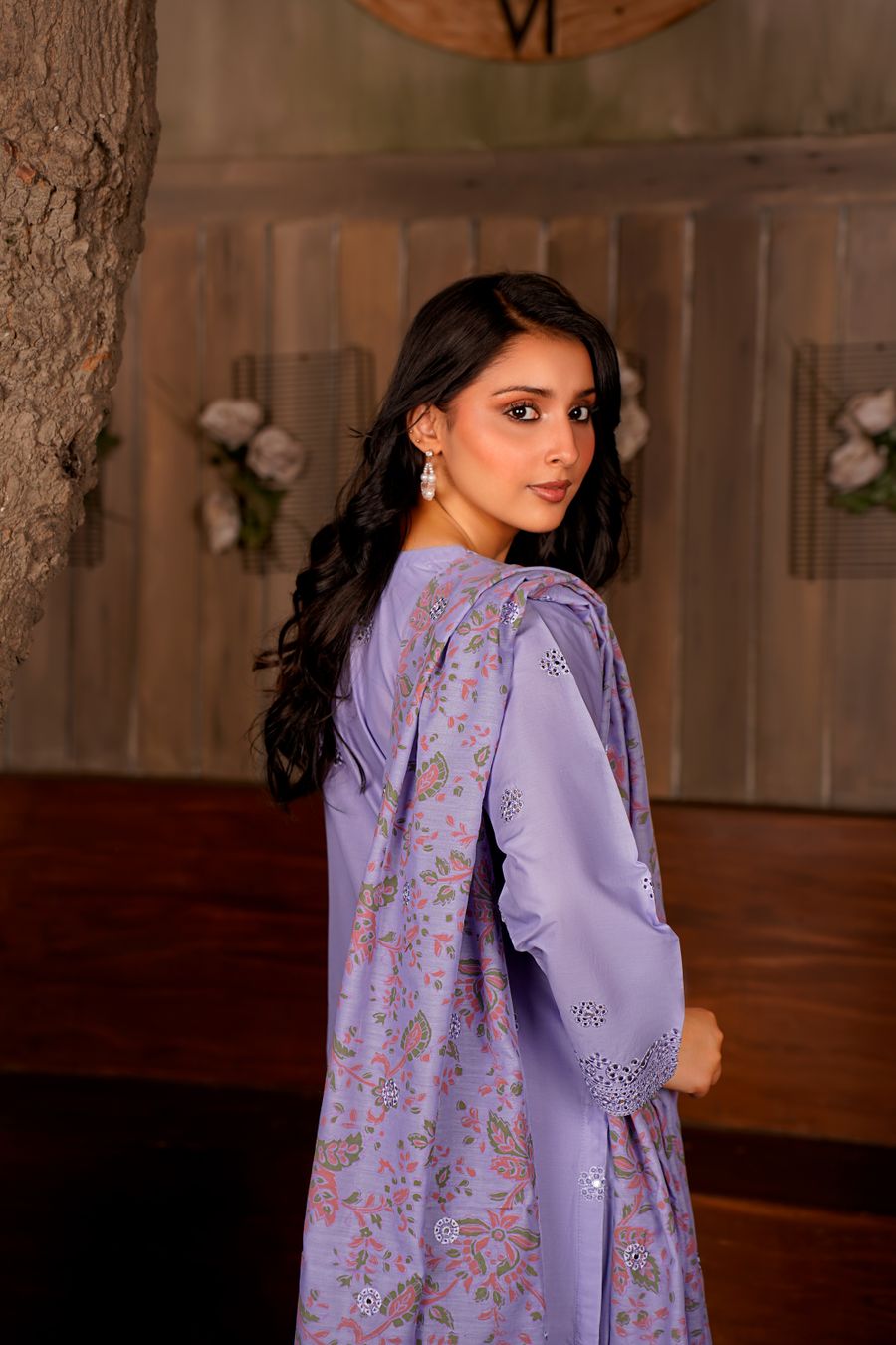 Elegant South Asian fashion model wearing a lavender traditional outfit