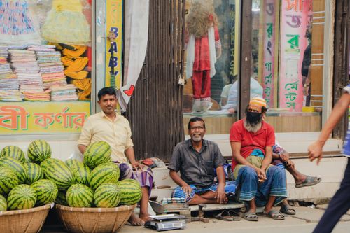 Free Street vendors in Dhaka, Bangladesh selling fresh watermelons. Vibrant local market scene. Stock Photo