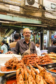 A bustling street food stall in Dhaka, Bangladesh, showcasing local delicacies during Ramadan.