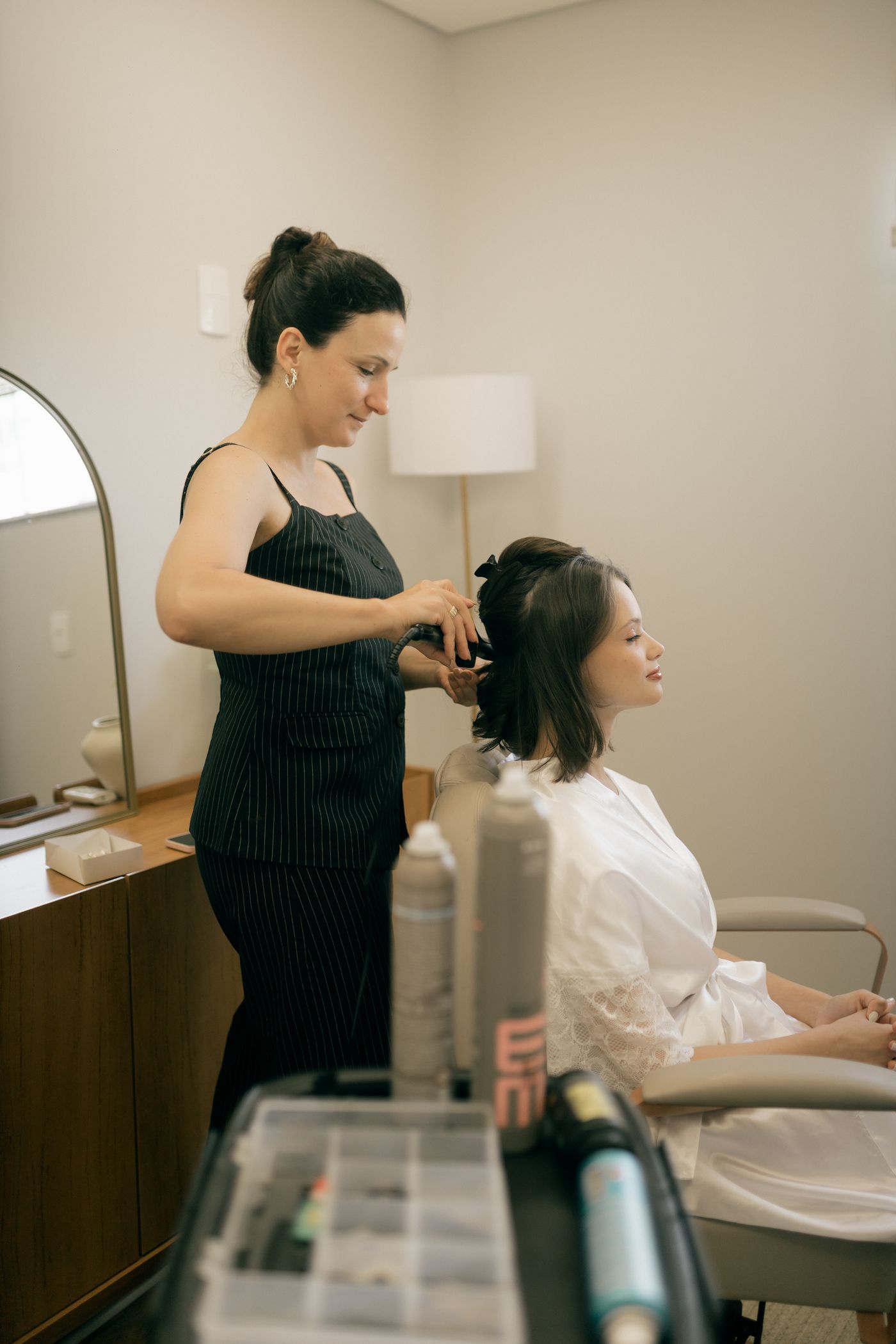 Stylist working with a client in a modern salon