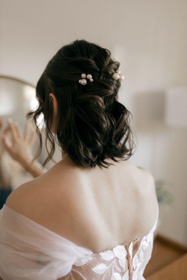 Pearl-adorned half-up hairstyle