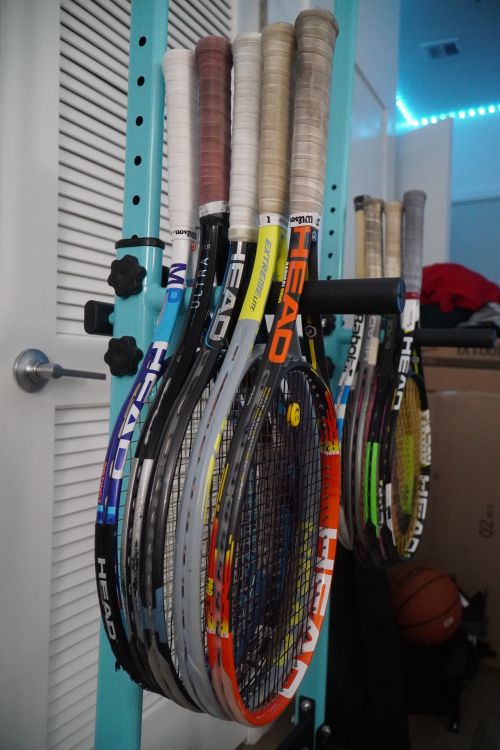 Inside Tennis Racket Collection of Tennis Rackets in Indoor Setting · Free Stock Photo