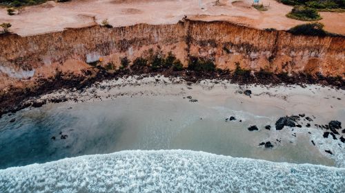 Free Stunning aerial view of cliffs and ocean in Natal, Brazil, showcasing natural beauty and dramatic landscape. Stock Photo