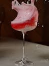 Dramatic Splash of Red Cocktail in Glass