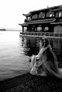 Serene Portrait of Woman in Traditional Garment by Lake