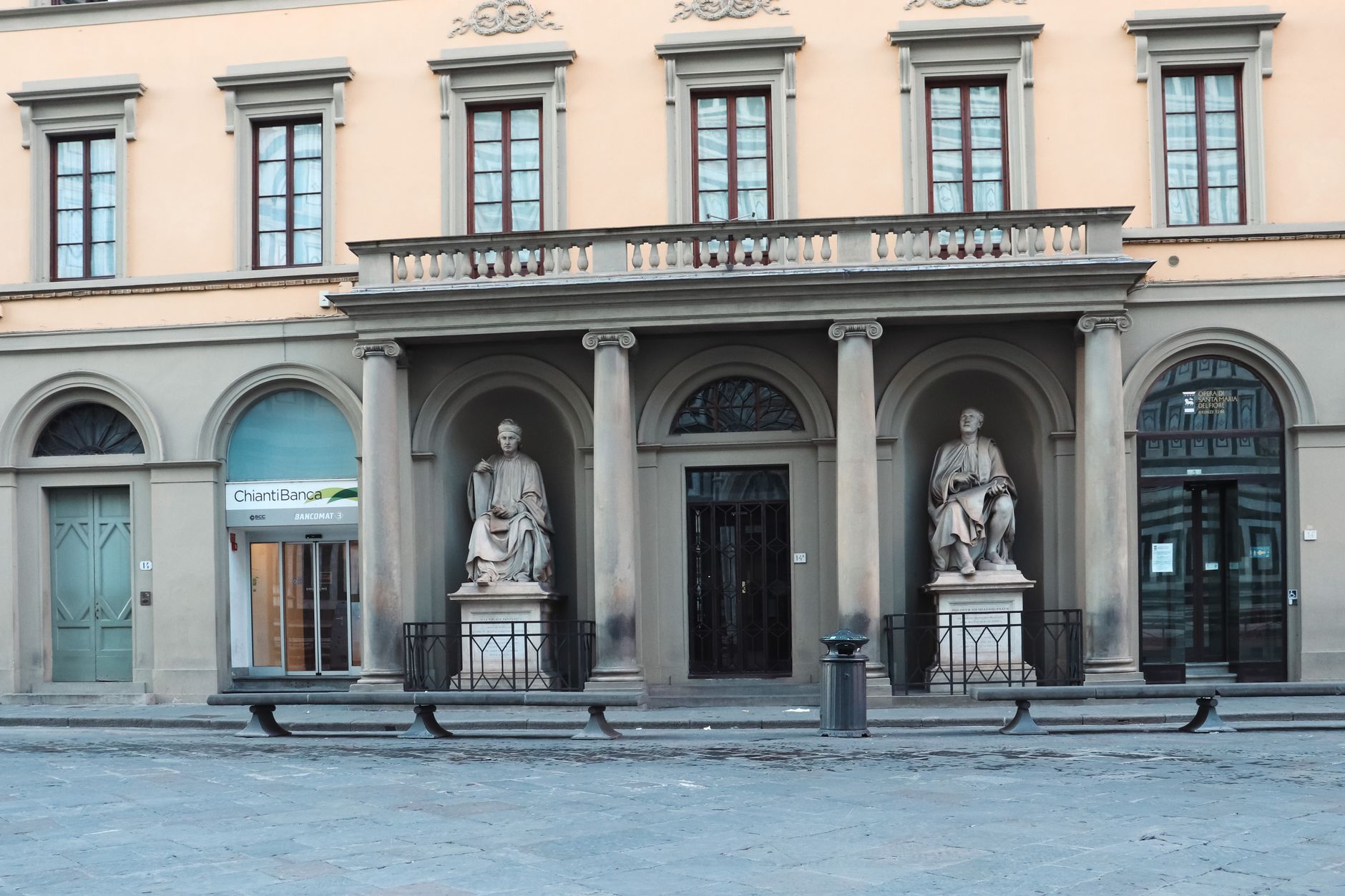 Facade with classic statues in Florence, Tuscany; showcasing Italian architectural elegance.