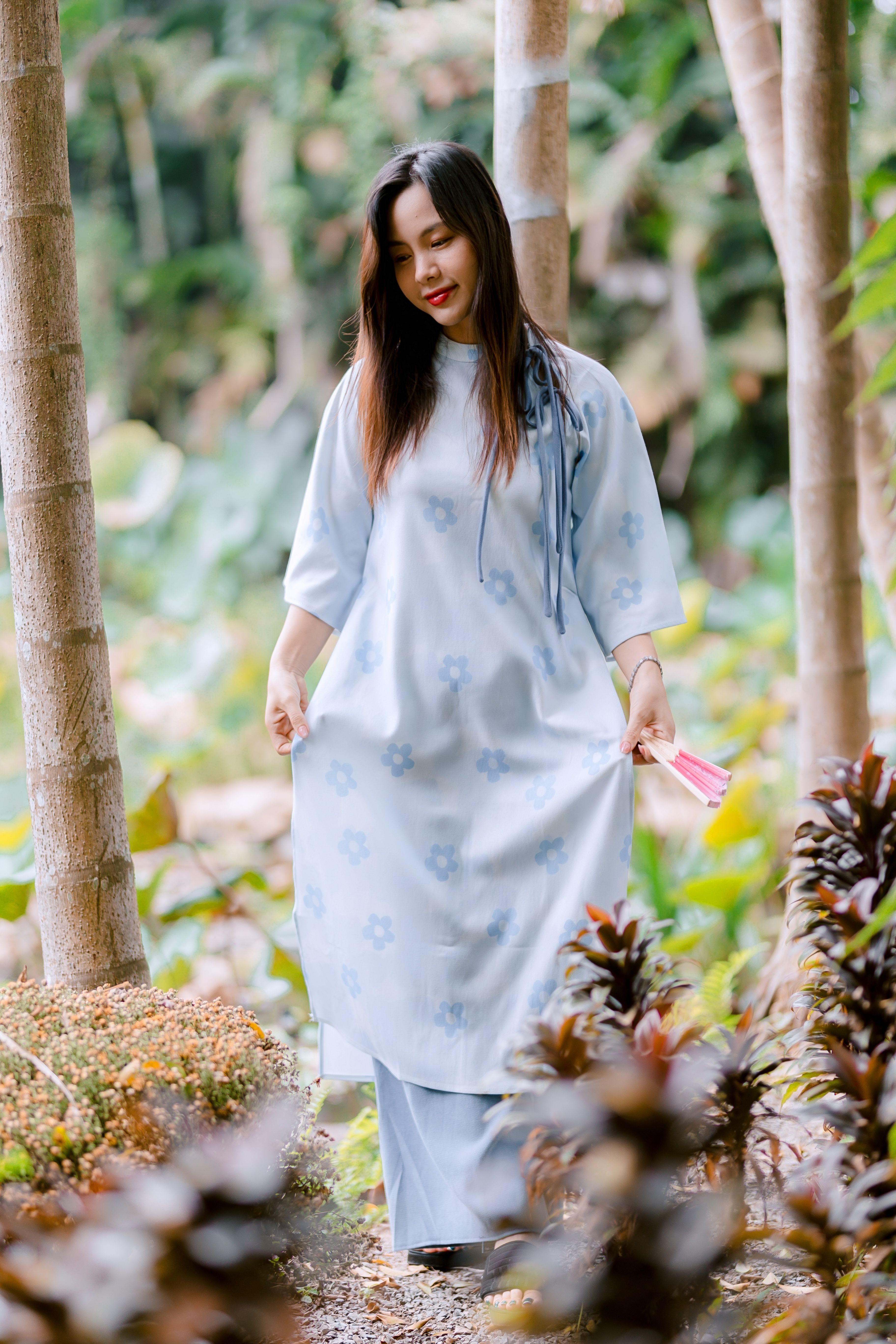 Woman in Traditional Blue Dress Walking in Nature · Free Stock Photo