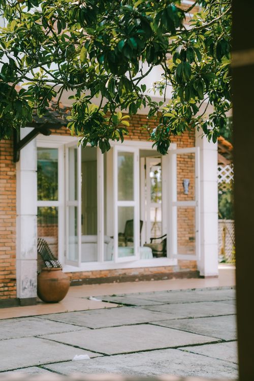 Free Peaceful suburban house with brick facade and garden view in Cisarua, West Java. Stock Photo
