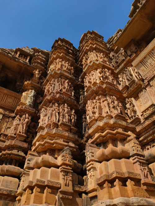 Free Detailed view of ornate sandstone carvings on Khajuraho temple, showcasing ancient Indian architecture. Stock Photo