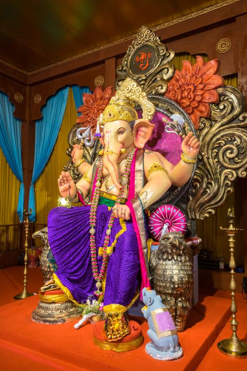 Free Vibrant Lord Ganesha idol adorned in a Mumbai temple during Ganesh Chaturthi festival. Stock Photo
