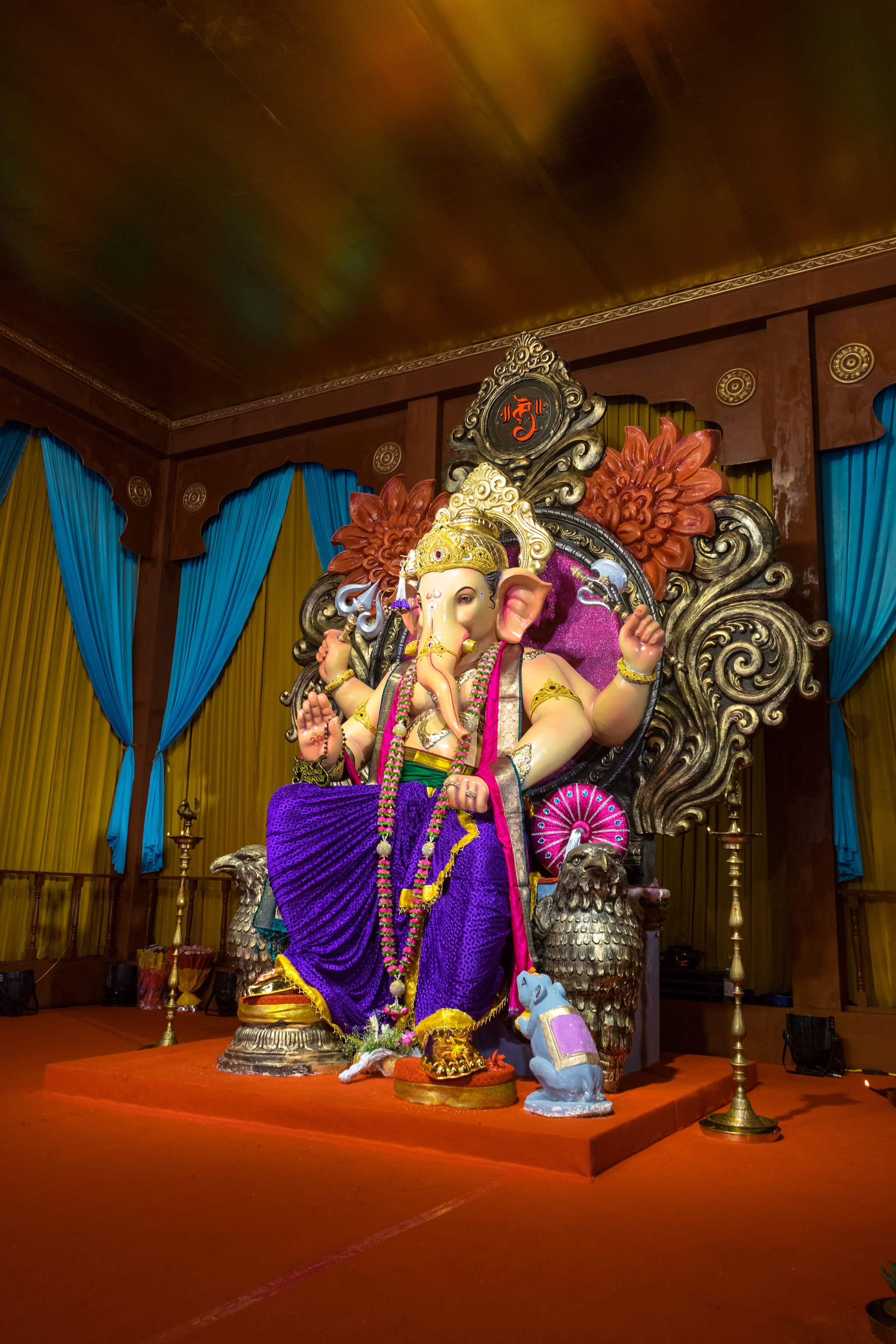 Colorful Ganesh idol in Mumbai temple during Ganesh Chaturthi festival.