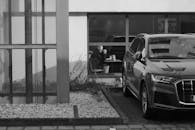 Urban Scene with Car and Man in Cafe