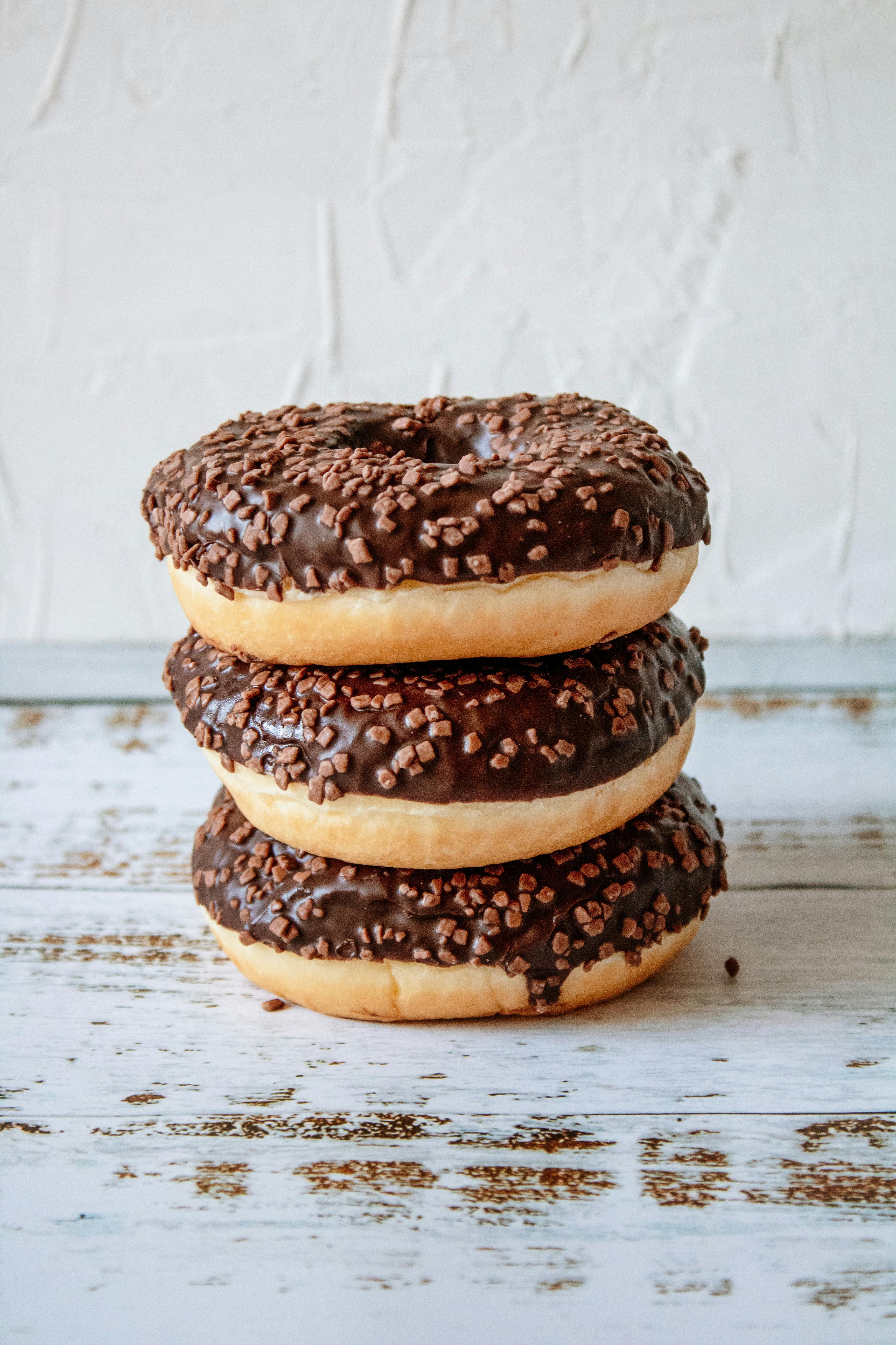 photo of stacked chocolate donuts