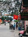 Street Scene with Bicycles and Flags in Vietnam