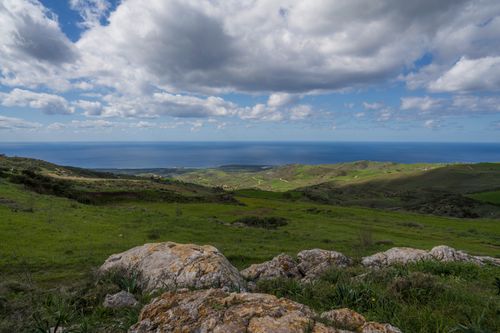 Free Breathtaking view of Cyprus coastline with green hills and cloudy sky. Stock Photo
