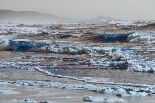 Scenic view of waves crashing on Guaratuba beach, Paraná, Brazil at daytime.
