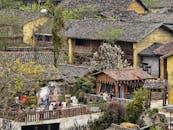 Traditional Village with Rustic Architecture in Spring