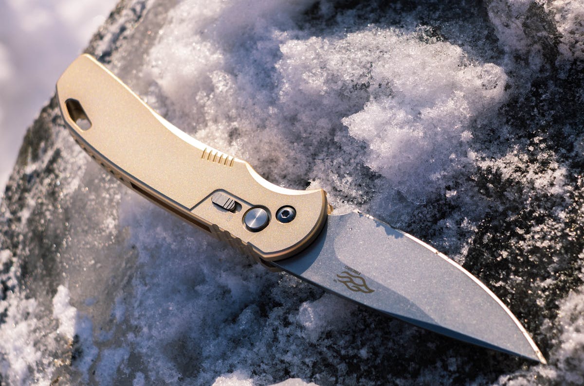 Stationery knife on colored surface