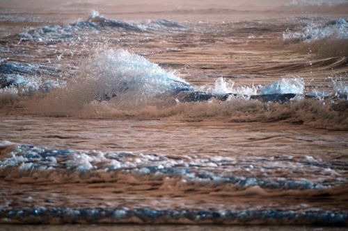 Free Peaceful ocean waves captured at dusk, showcasing nature's beauty and tranquility. Stock Photo