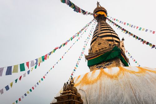 Free Swayambhunath Stupa in Kathmandu adorned with vibrant prayer flags, a symbol of peace and spirituality. Stock Photo