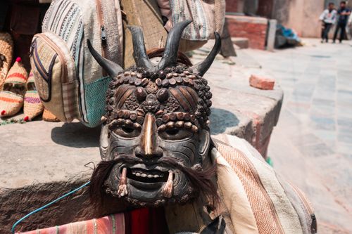 Free Close-up of a traditional wooden mask on a market stall in Kathmandu, Nepal. Stock Photo
