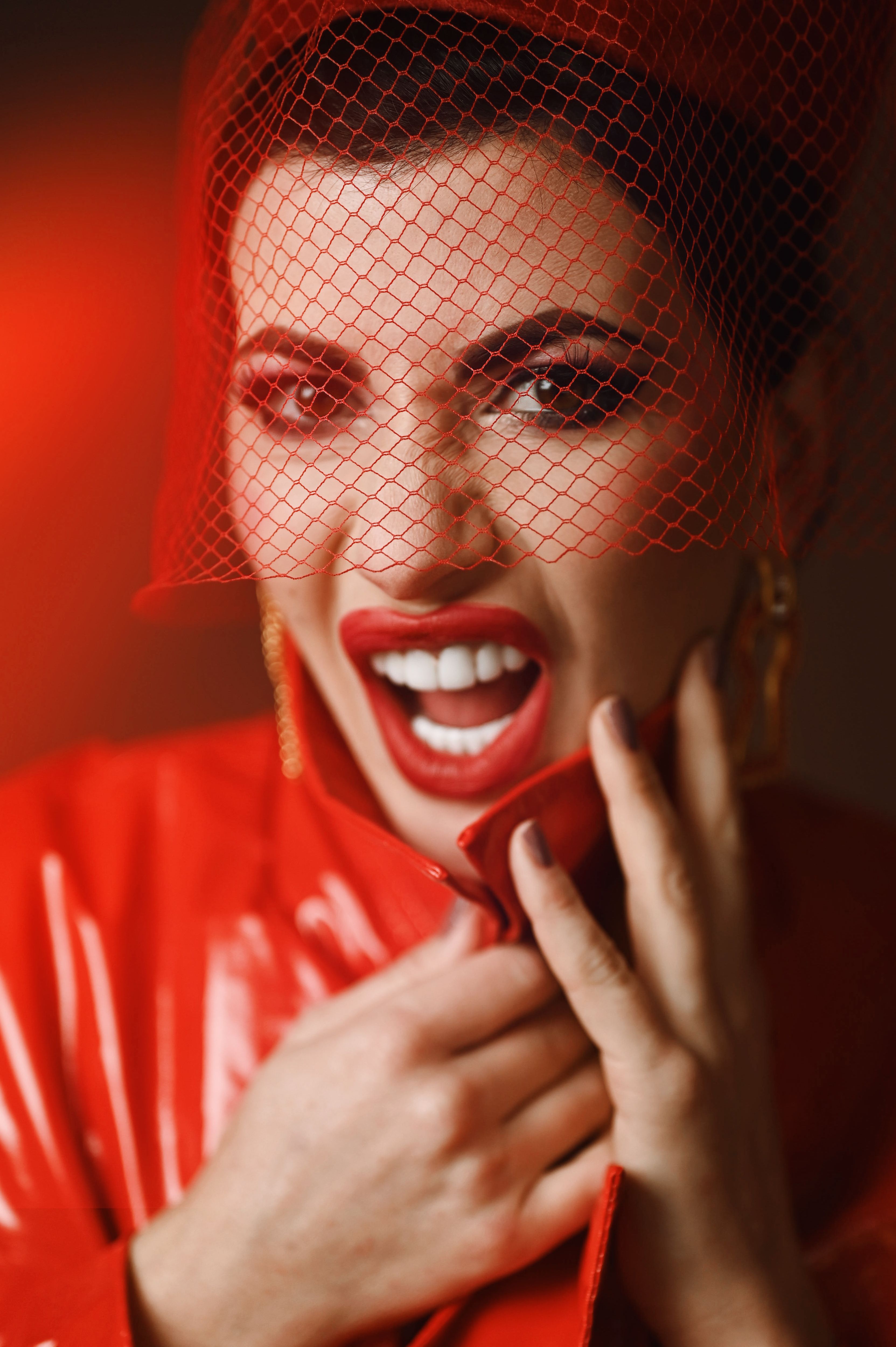 Elegant Woman in Red Veil and Coat Portrait · Free Stock Photo