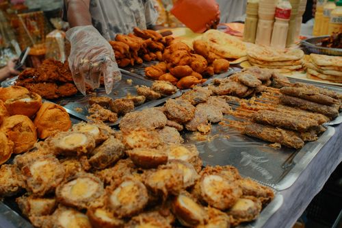 Free A variety of traditional foods displayed at a bustling Dhaka Iftar market during Ramadan. Stock Photo