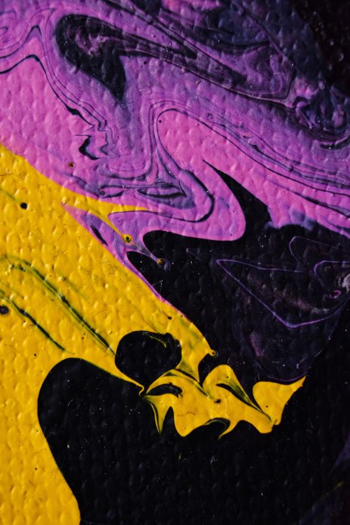 Free Dynamic abstract painting with bold yellow and purple swirls on a textured canvas. Stock Photo