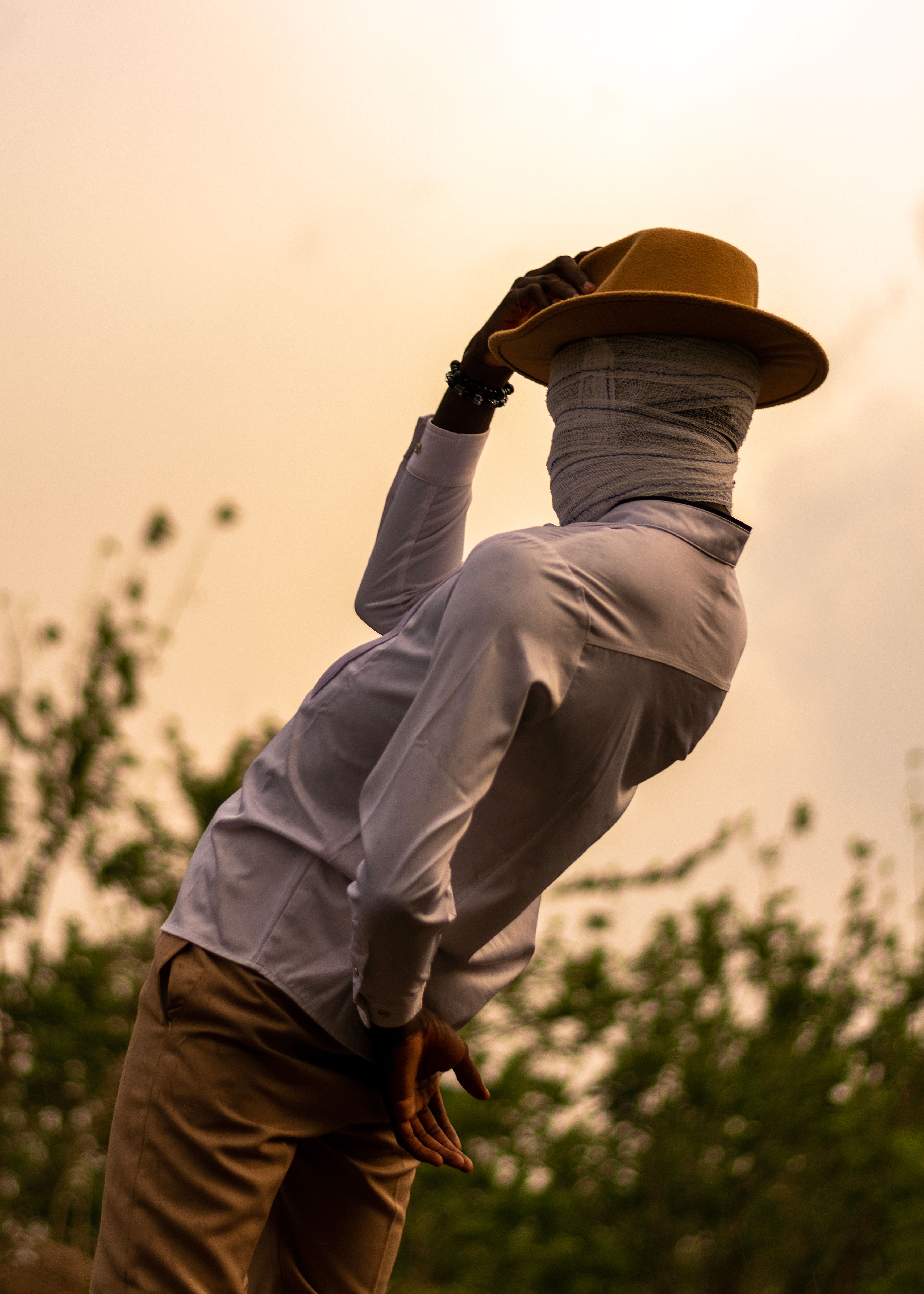 Artistic Portrait of Man with Covered Face Outdoors · Free Stock Photo
