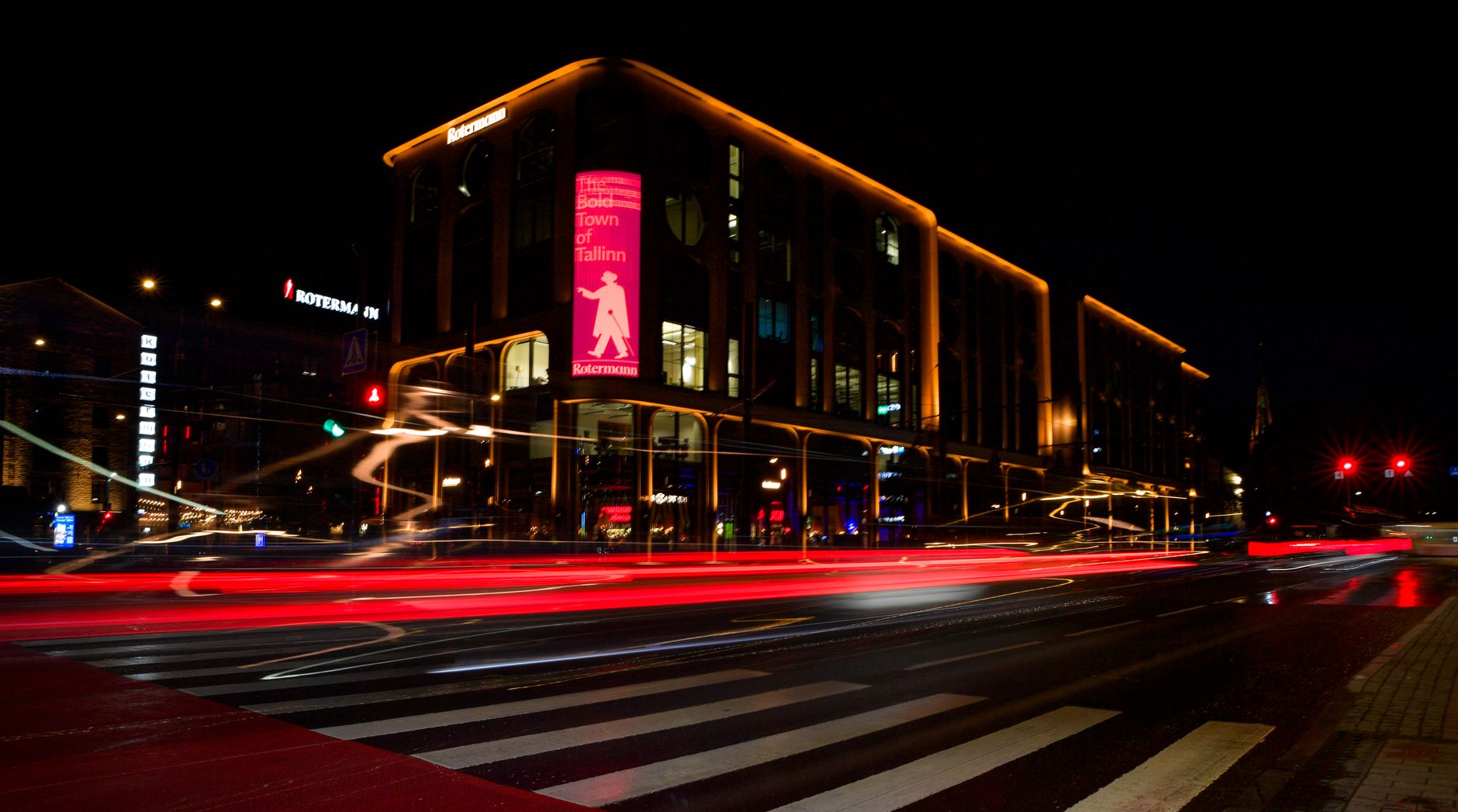 Long exposure of Rotermann Quarter in Tallinn, showing vibrant light trails on a rainy night.