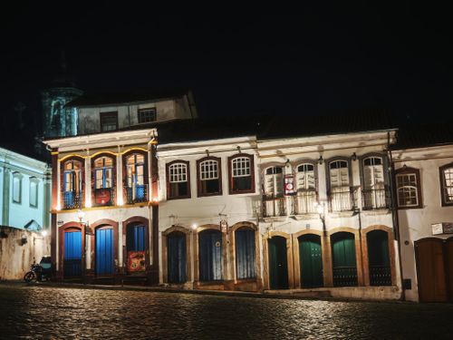 Free Charming colonial buildings lit up in Ouro Preto, Brazil. Iconic at night. Stock Photo