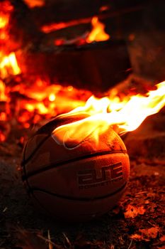A basketball engulfed in flames, combining sports and dramatic visuals.