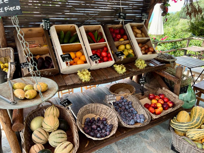 Fresh fruit and vegetables on a rustic outdoor market stall, photo by tamira kanemägi on Pexels
