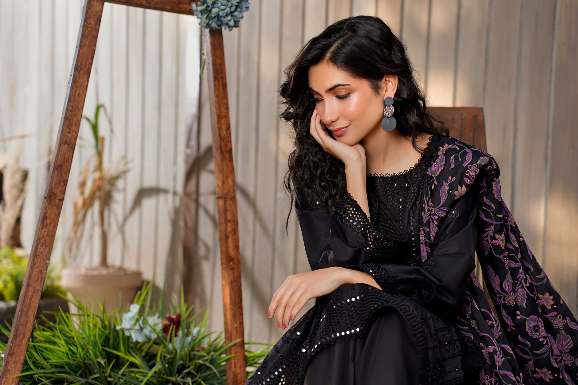 A close-up of a beautifully embroidered digital printed lawn showcasing vibrant floral patterns and delicate stitching.