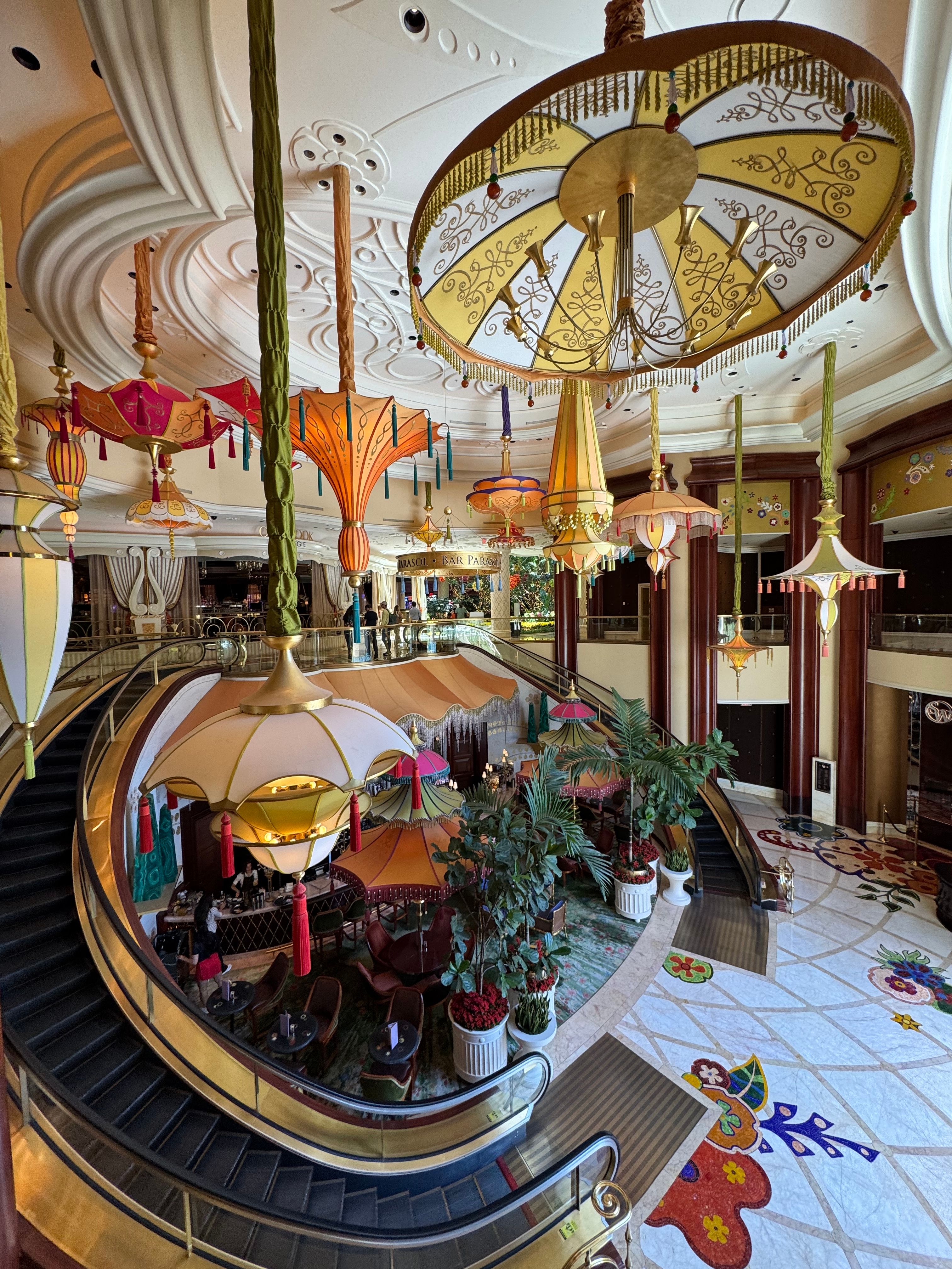 Luxurious interior design of a Las Vegas casino with elaborate lighting and vibrant decor.