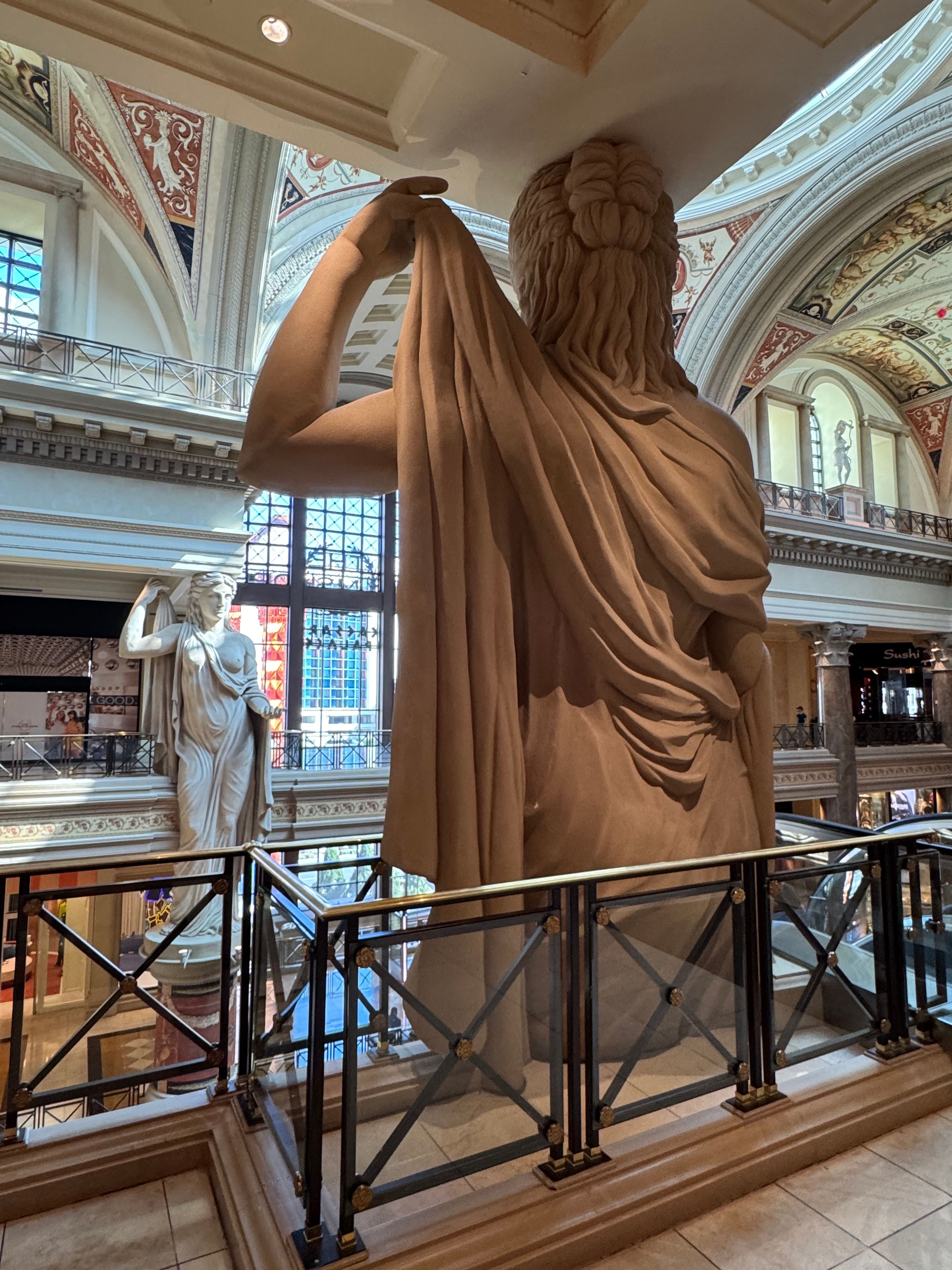 Captivating view of grand statues inside The Forum Shops at Caesars Palace, Las Vegas.