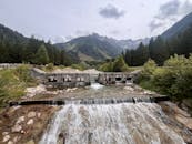 Scenic Waterfall and Bridge in Lombardy, Italy