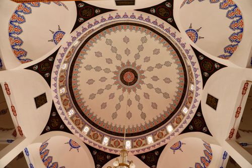 Free Top view of a beautifully decorated mosque ceiling showcasing stunning Islamic art and architecture. Stock Photo
