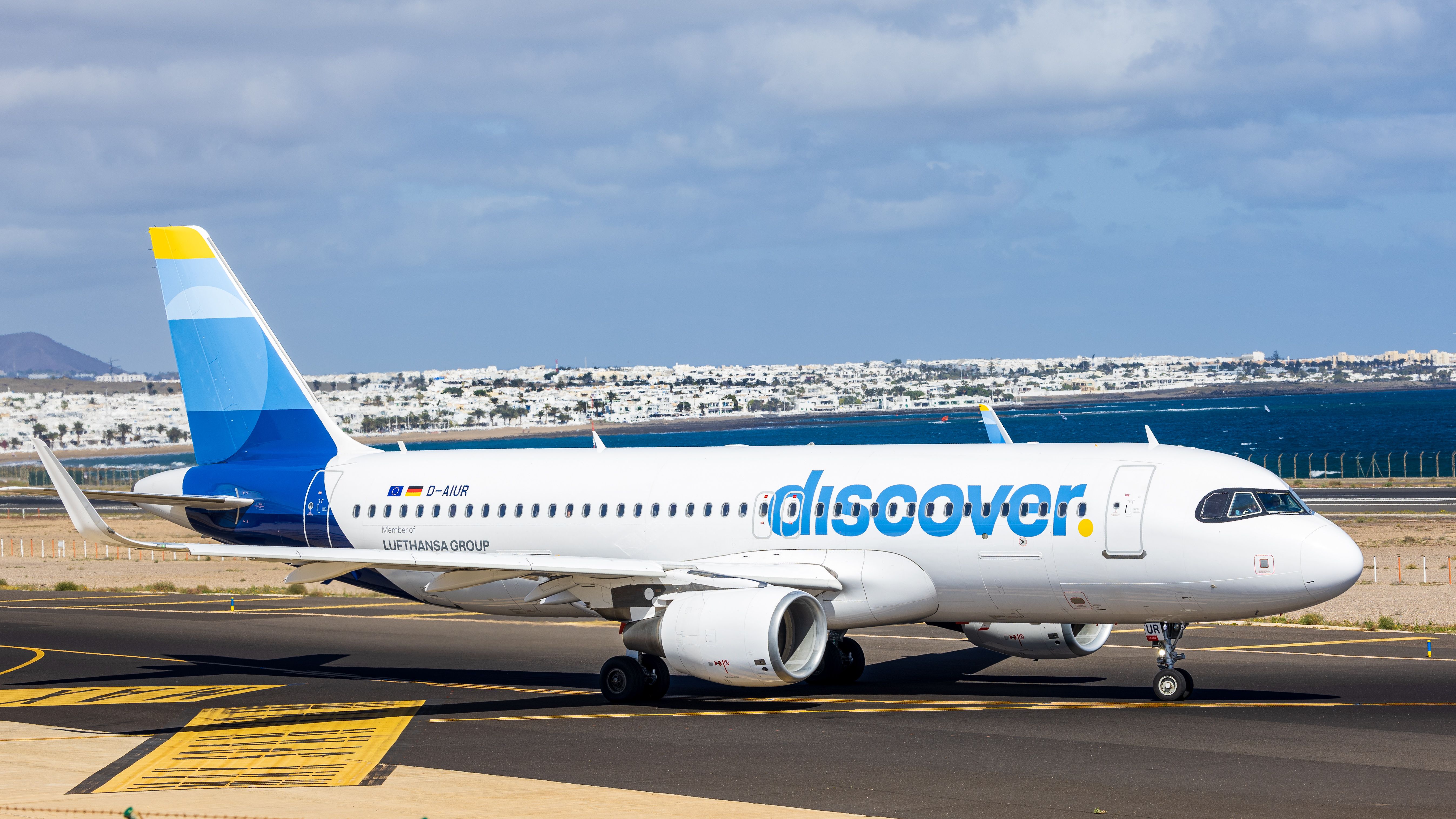 Airplane on a sunny day at Lanzarote airport, Spain, with clear skies. — lounges at Lanzarote Airport