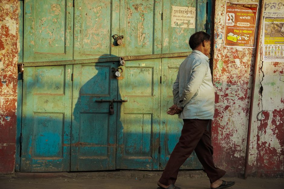 man standing in front of locked door