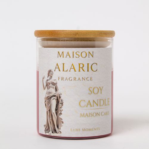 Free Sophisticated soy candle by Maison Alaric with a wooden lid, perfect for a luxe ambiance. Stock Photo