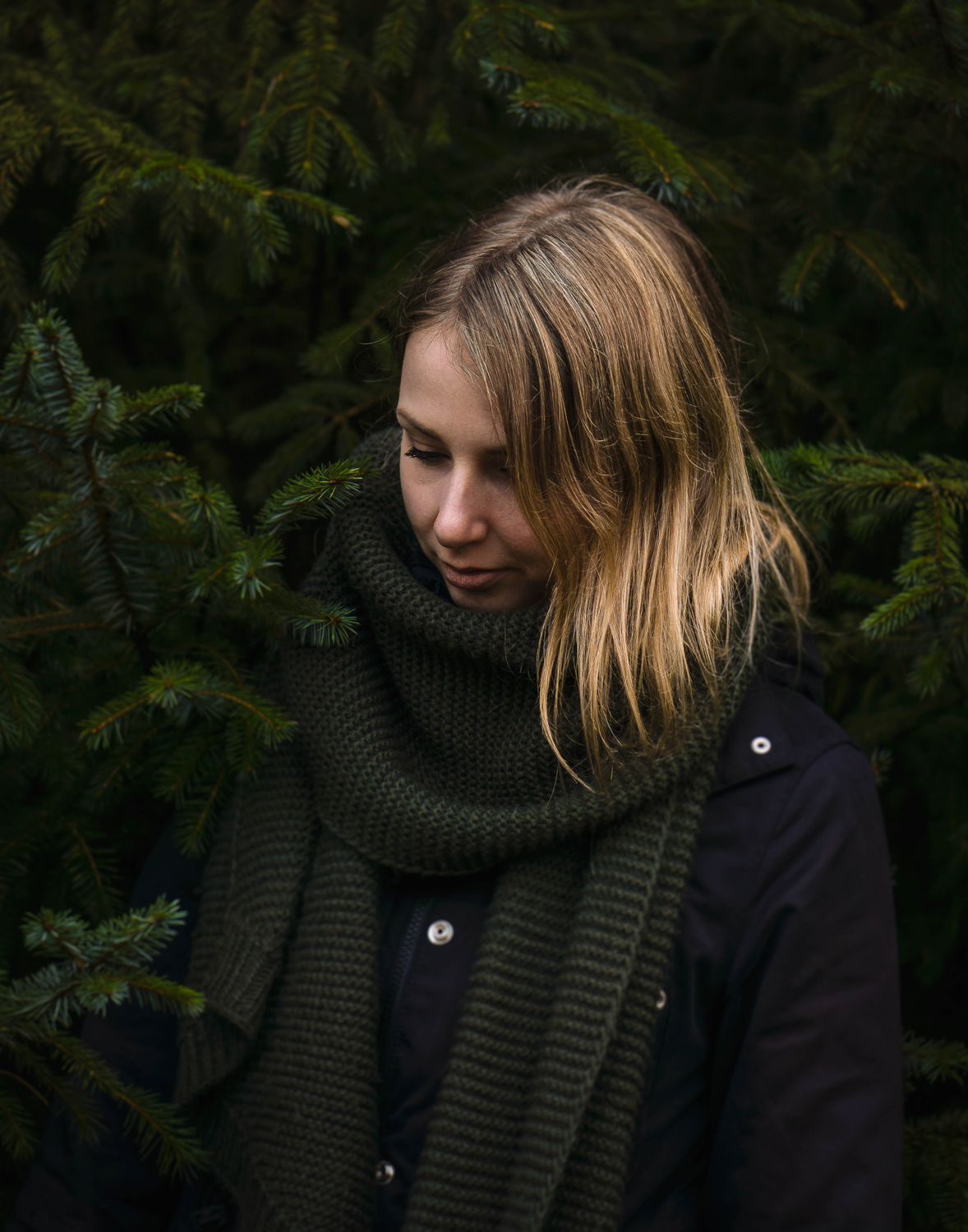Woman in Black Jacket Standing Near Green Trees · Free Stock Photo