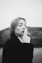 Black and White Portrait of Woman Smoking Outdoors