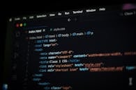 HTML Code on Computer Screen in Dark Mode