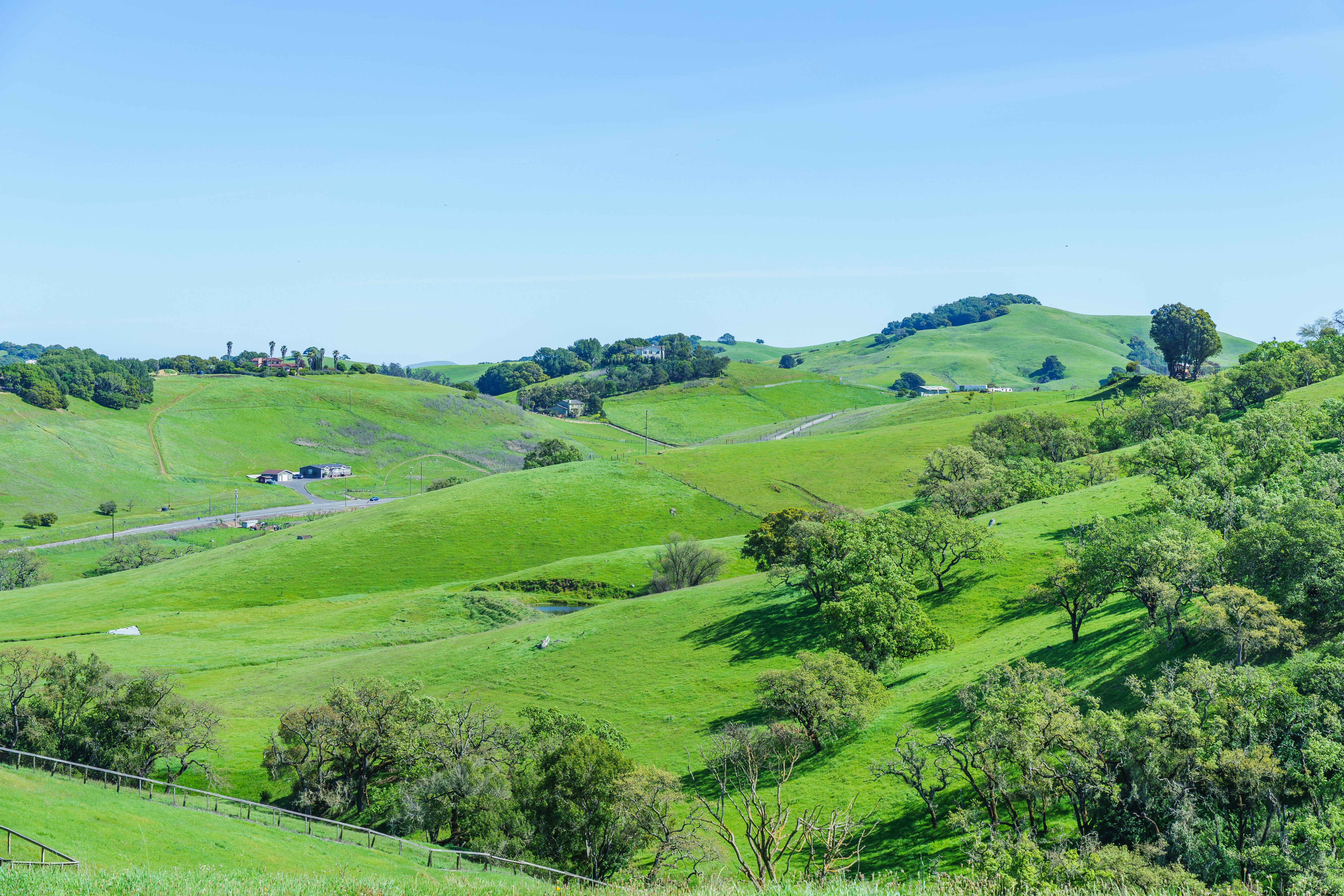 Lush Green Hills with Clear Blue Sky · Free Stock Photo