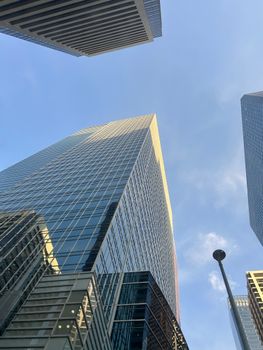 A breathtaking view of modern skyscrapers in downtown Calgary, Alberta, Canada under a clear blue sky.