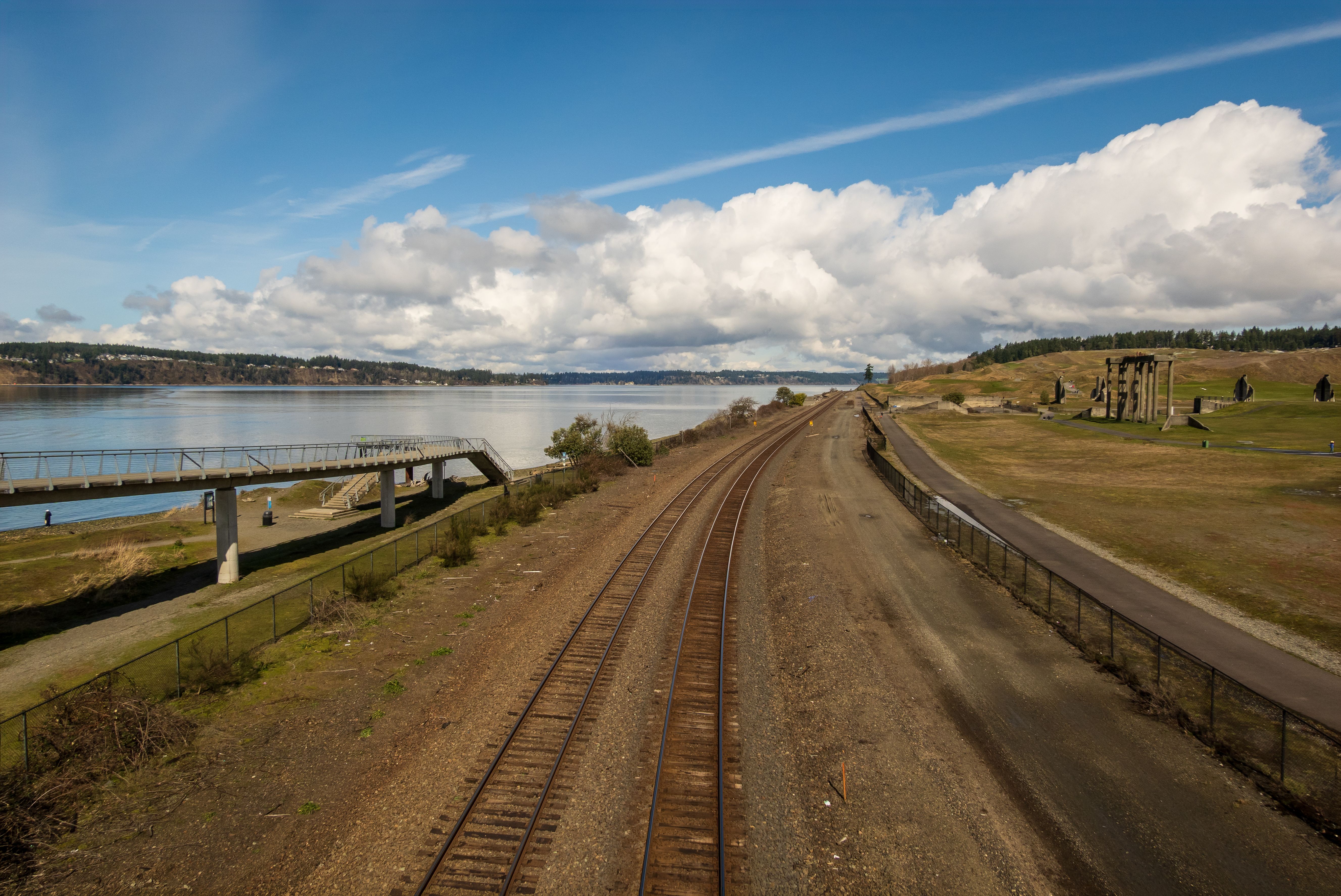 Scenic Railroad Track by Lakeside in Spring · Free Stock Photo